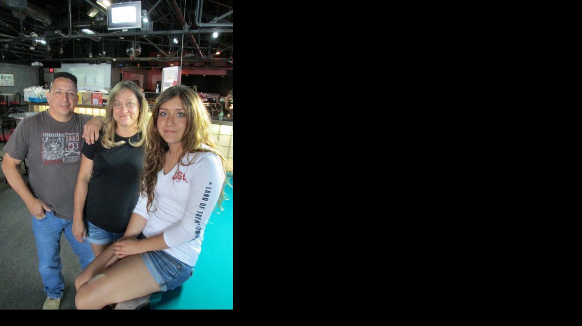 Pat Alvarez, with wife Wendy and daughter Summer, says he wants Old Town’s Boots & Buckles to be “a good, clean country bar where you can sit and relax and have a good time.”