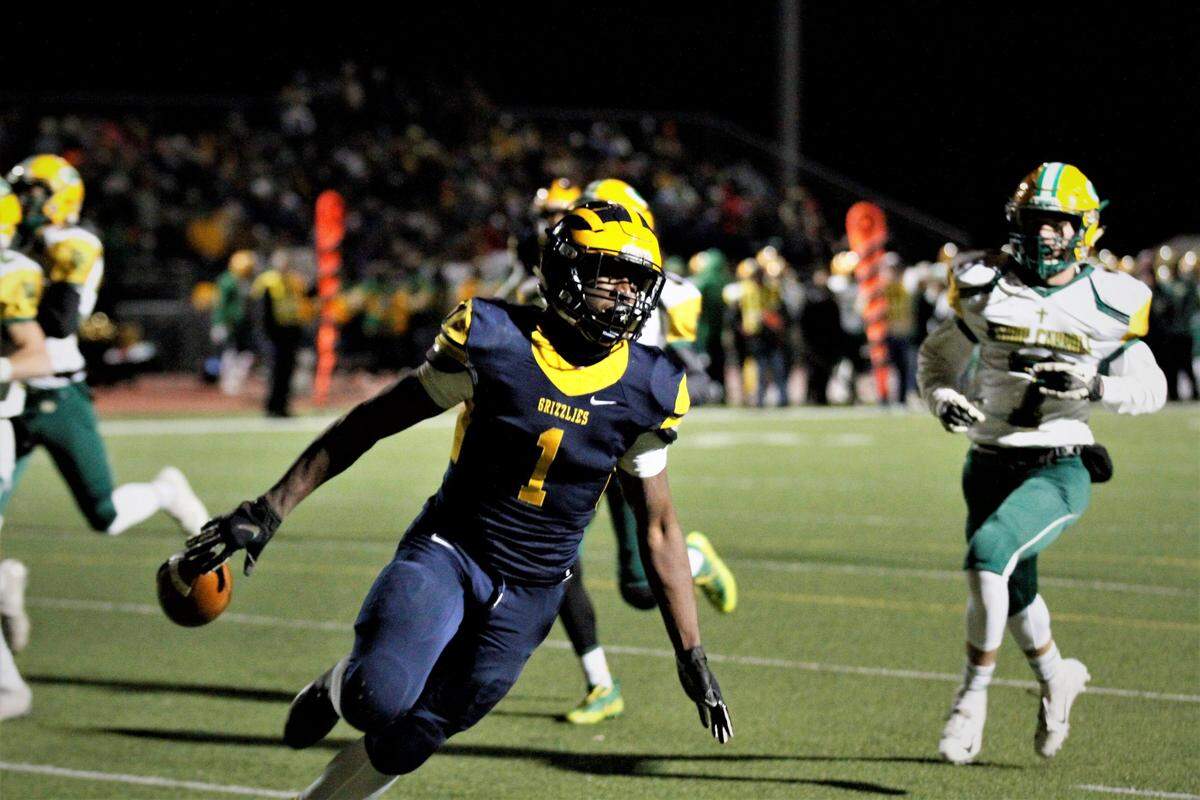 Wichita Northwest running back Breece Hall runs in his first of six touchdowns of the night in the Grizzlies’ historic 84-67 win over Bishop Carroll on Friday. (Nov. 9, 2018)