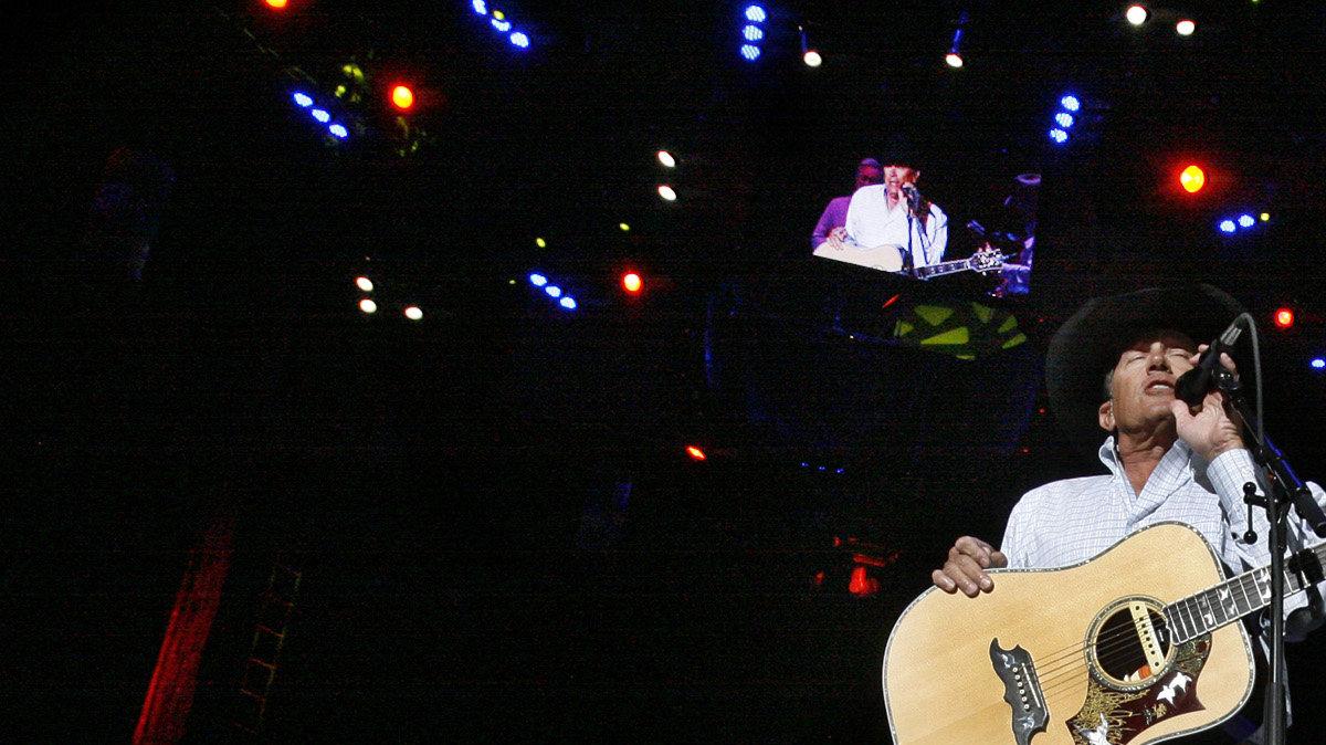 Country star George Strait sings to the crowd at the Intrust bank Arena Friday (Feb. 19, 2010).