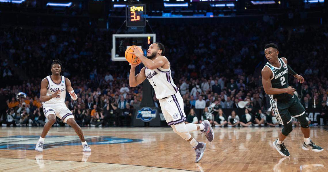 Kansas State’s Markquis Nowell makes an off-balance three-pointer just before the shot clock expired during the second half of a Sweet 16 win over Michigan State at Madison Square Garden on Thursday night.