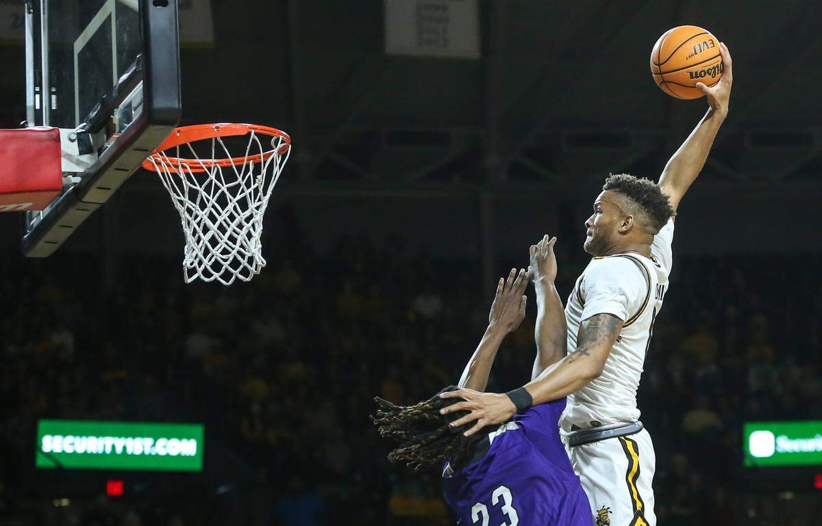 Wichita StateÕs Dexter Dennis dunks the ball during the first half of their game against Prairie View A&M on Wednesday night at Koch Arena.