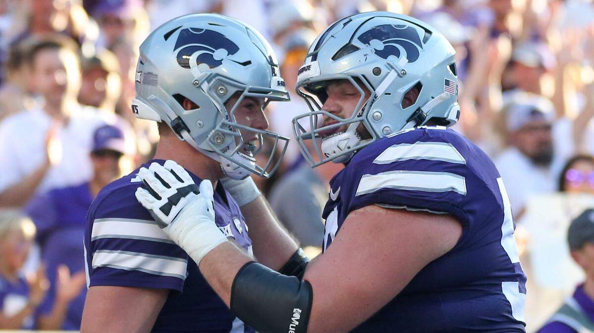 Kansas State Wildcats offensive lineman Cooper Beebe (right) congratulates quarterback Will Howard following a touchdown in the second quarter against the Southeast Missouri State Redhawks at Bill Snyder Family Football Stadium on Saturday, Sept. 2, 2023.
