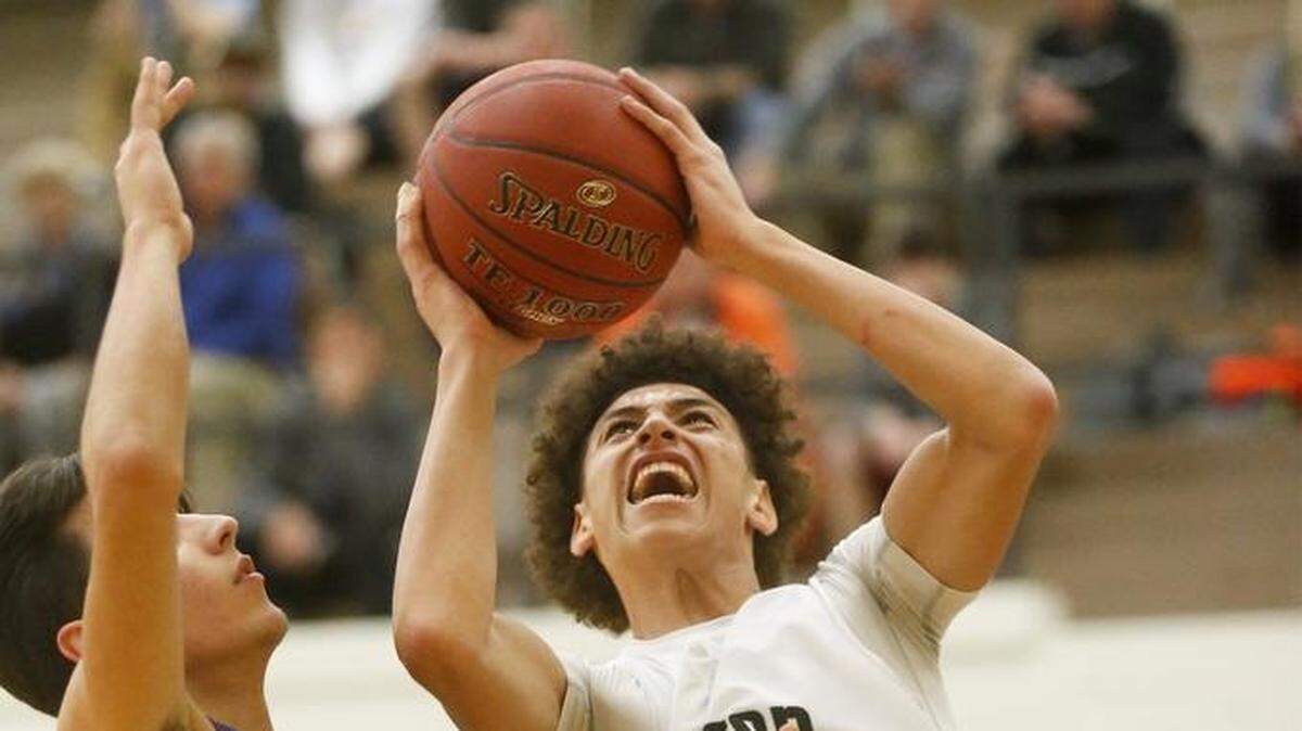 Newton's Ty Berry (center) was offered a scholarship to play basketball at Wichita State University on Monday. Berry is a junior-to-be and rated a four-star recruit in the class of 2020.