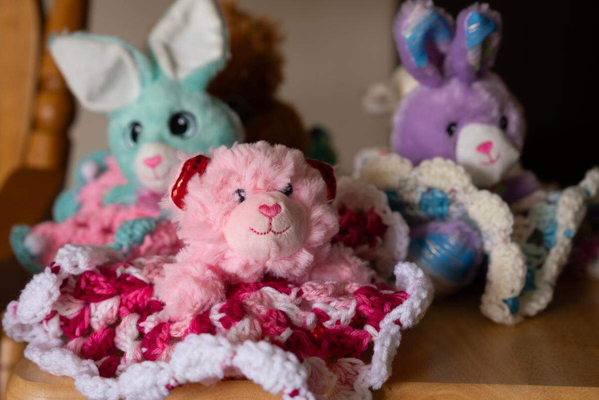 In addition to her drawings, Kay Ferris also creates loveys for children by crocheting colorful skirts from stuffed animals she buys at dollar stores. She’ll sell them at Harvester Arts and donate the items and the money from them to the Treehouse.
