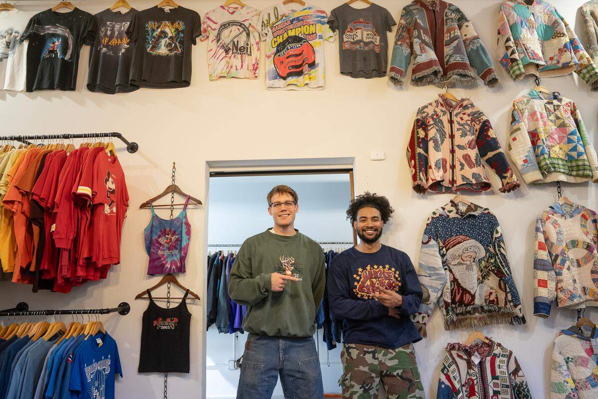 Two A.M. Fits owner C.R. Curless, left and YBG Studios owner Mark Lozada have set up their clothes in a space they share with Knockout Sneaker Boutique at 600 E. Douglas.