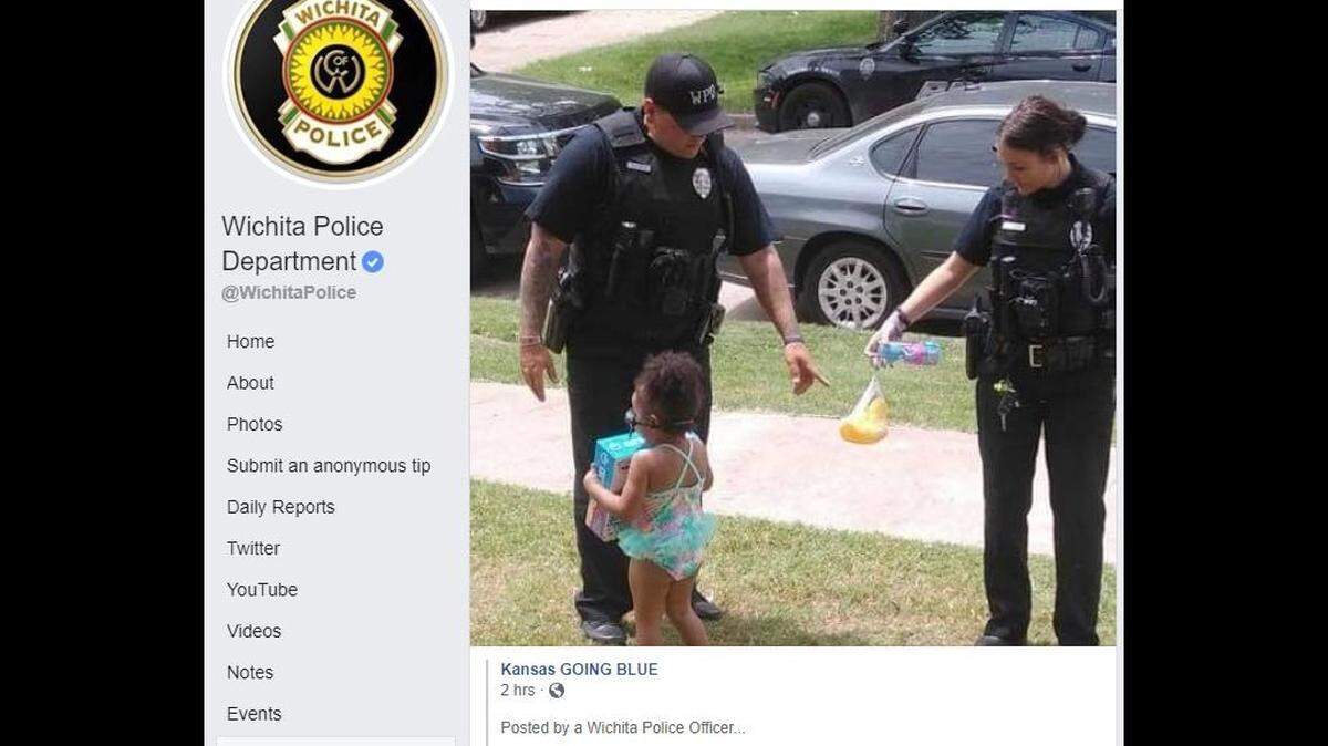 Two Wichita police officers bought a kids pool and toys for a girl who wanted to go swimming.