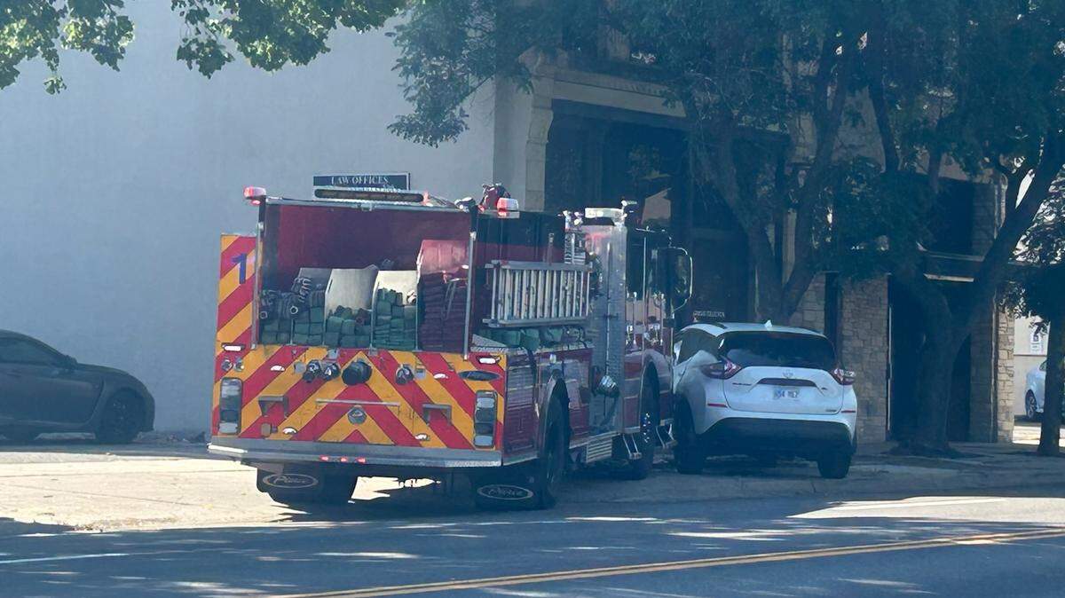 A Wichita fire truck struck a car that turned in front of it Friday morning on Main Street in downtown.