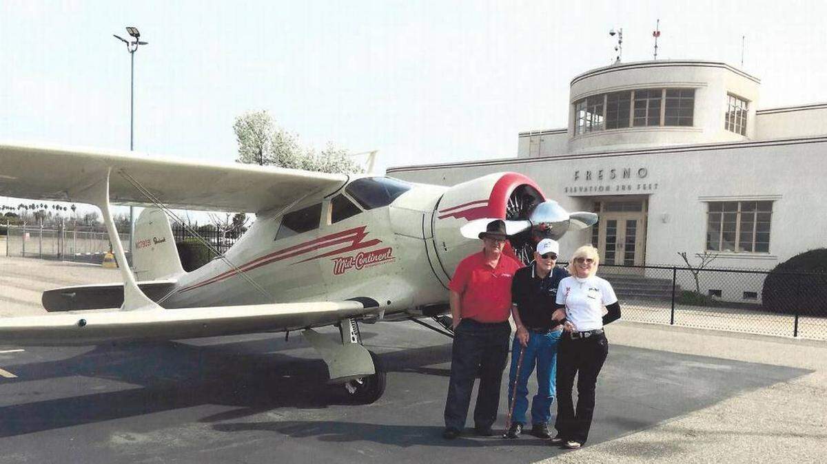 From left, Pat Napolitano stands with World War II Col. Bud Anderson and Kelley Kreeger in April. Napolitano was killed in a crash Friday in the Beechcraft Model 17 Staggerwing he was flying for Wichita-based Mid-Continent Instruments and Avionics.