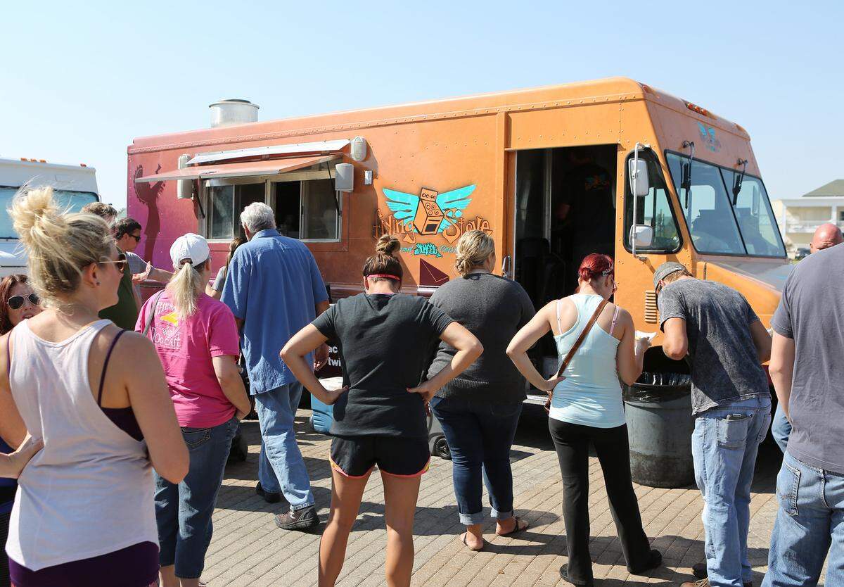 People line up to try The Flying Stove at one of Wichita’s early food truck rallies.