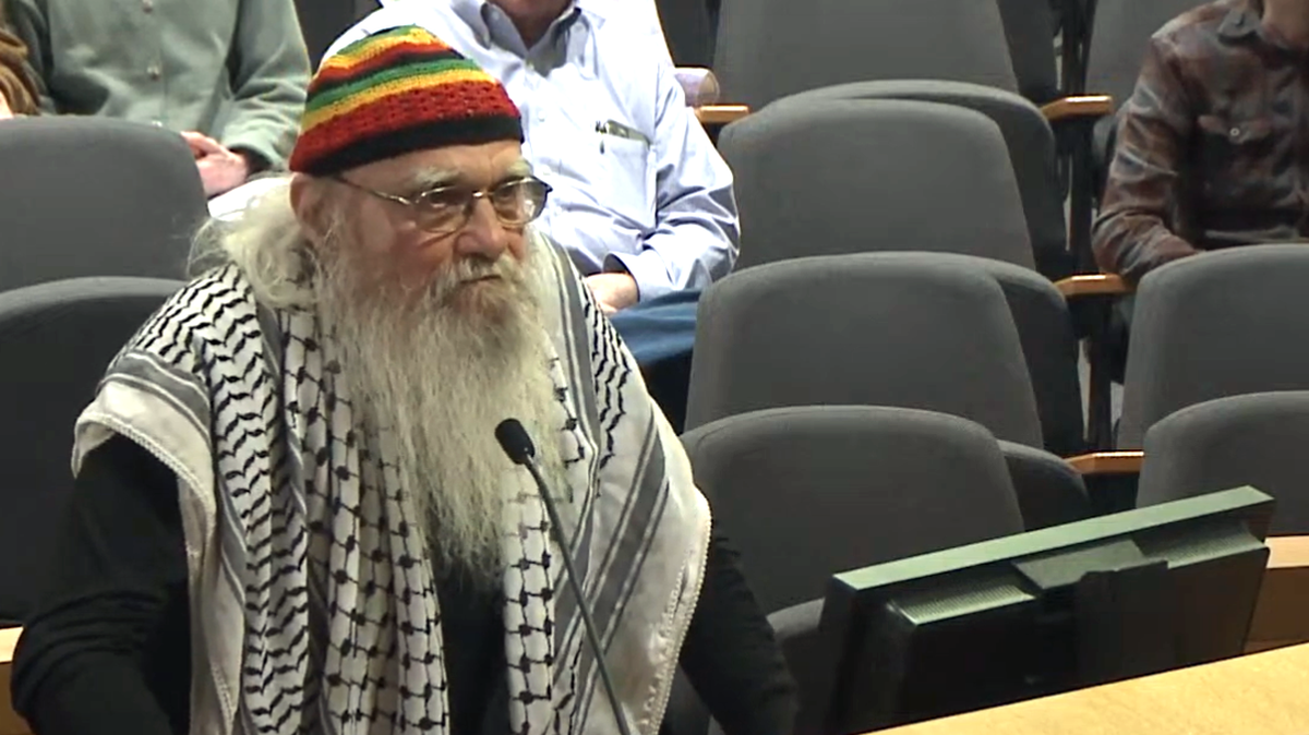 William Anderson speaks to the Wichita City Council on March 19, asking each member individually if they would support a ceasefire resolution. Three council members expressed their support.
