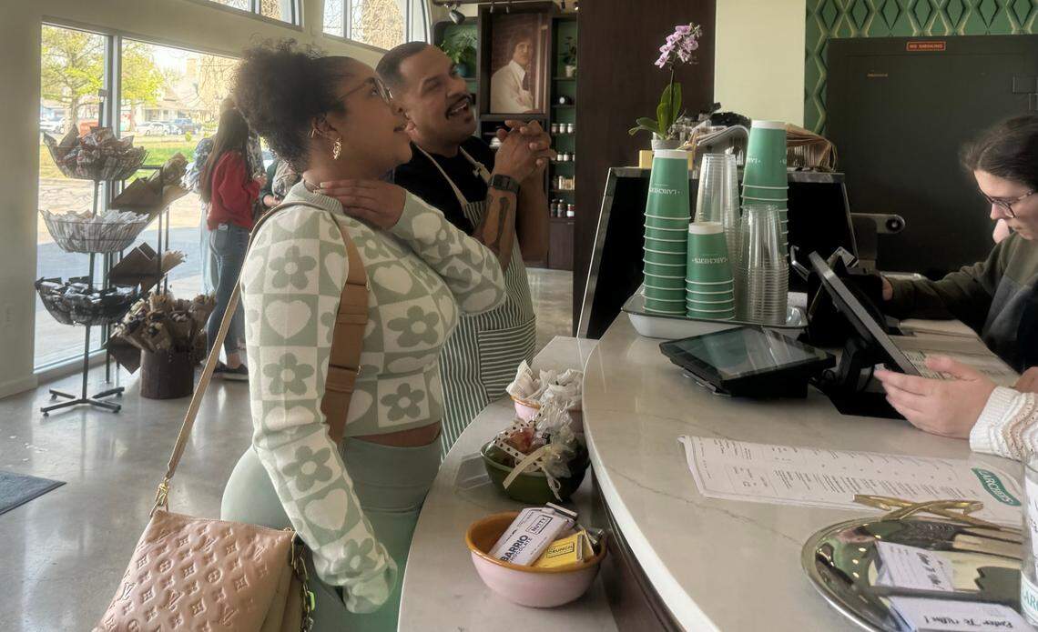 Chef Kevin Lebron helps a customer decide what to order at the new Larcher’s Market, where he serves as operations director.