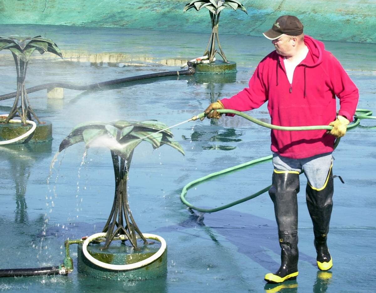Wichita Parks Department worker Bart Young was shown cleaning the flower fountains by Park Villa in Riverside Park in this January 2006 file photo. "We try to clean the pond three times a year," Young said, "but sometimes it's more often when there's a lot of leaves."