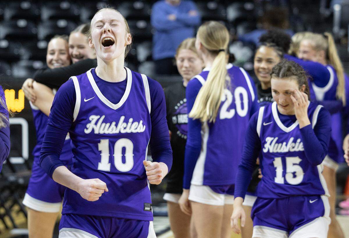 Blue Valley Northwest’s Regan Becker lets out a yell after the 8th seeded Huskies upset top-ranked Wichita Heights on Tuesday at the quarterfinals of the 6A basketball tournament at Koch Arena.