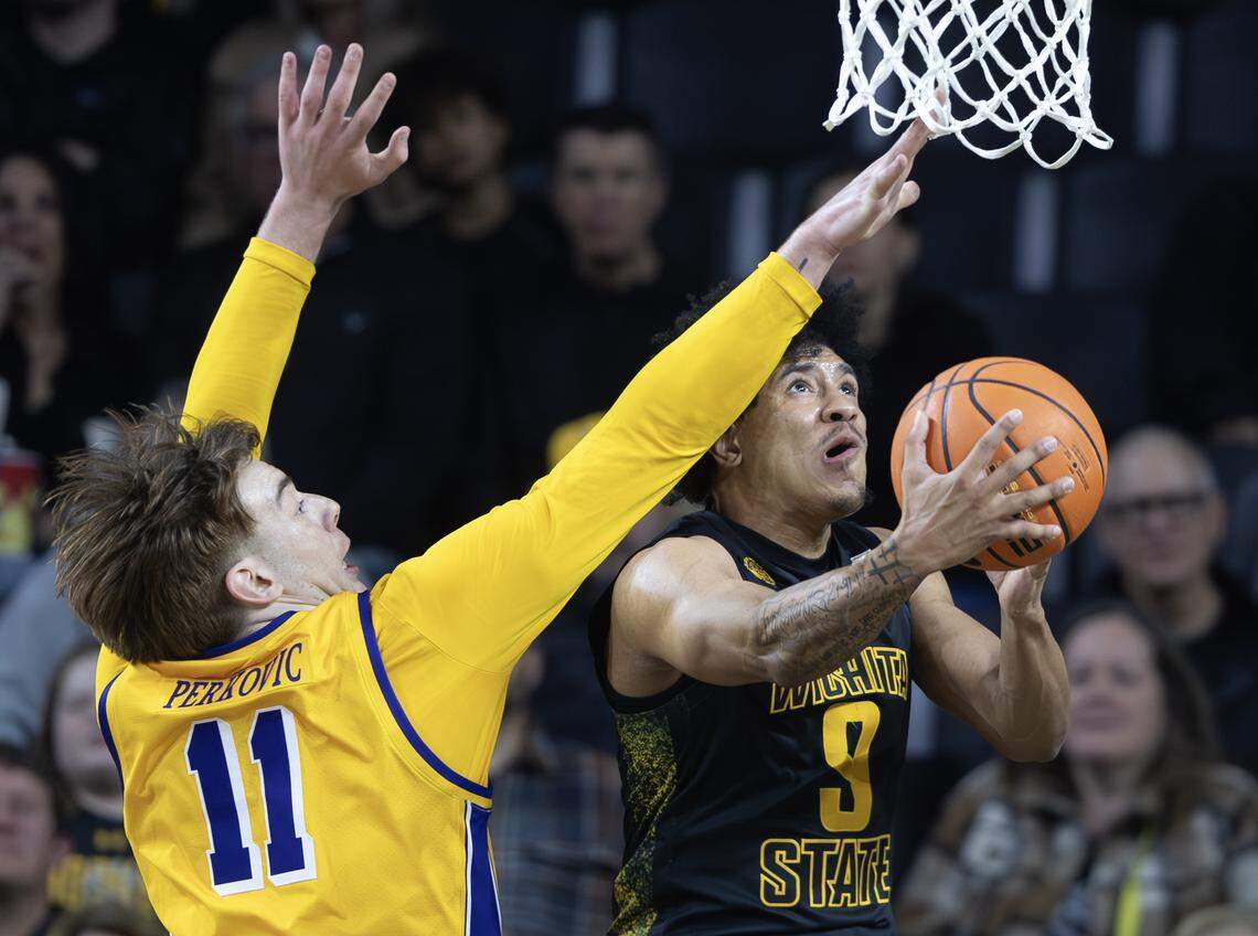 Wichita State’s Michael Gray Jr., taken shot against East Carolina’s Vito Perkovic on Wednesday night at Koch Arena.