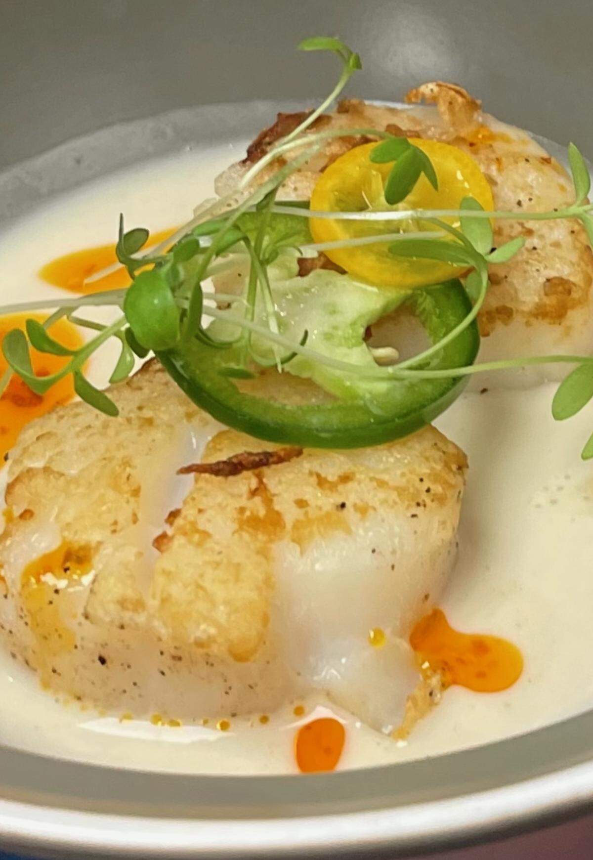 Sea scallops are one of the new entree items on the menu at The Belmont, 3555 E. Douglas.