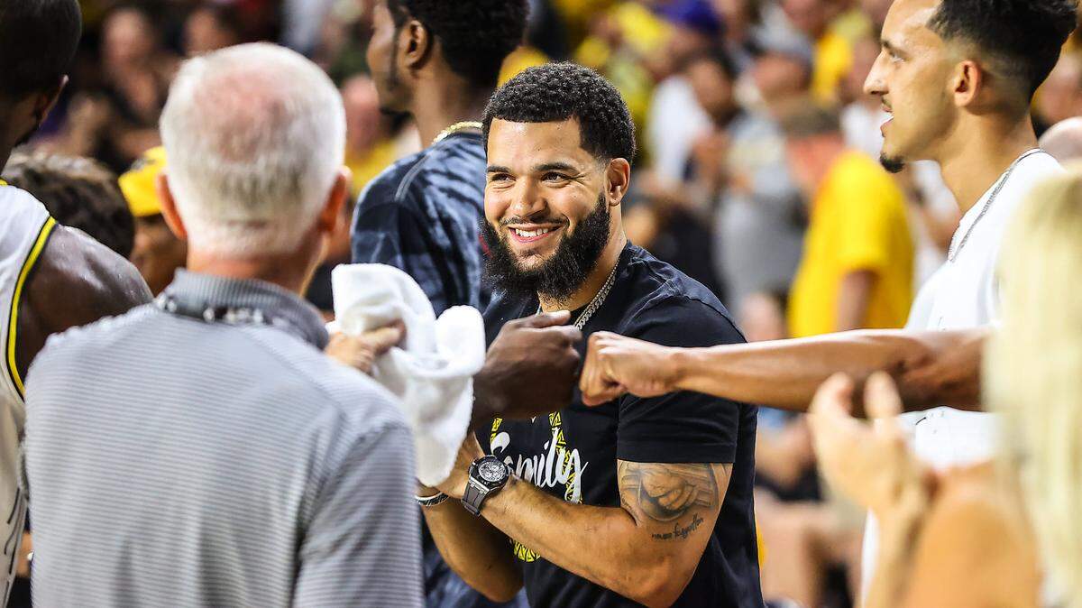 Fred VanVleet (center) made a $250,000 donation to help jumpstart the renovation of the Koch Arena weight room project.