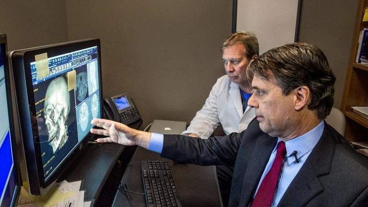 Gov. Jeff Colyer, right, is defending KanCare, one of his signature accomplishments during his time as lieutenant governor.
