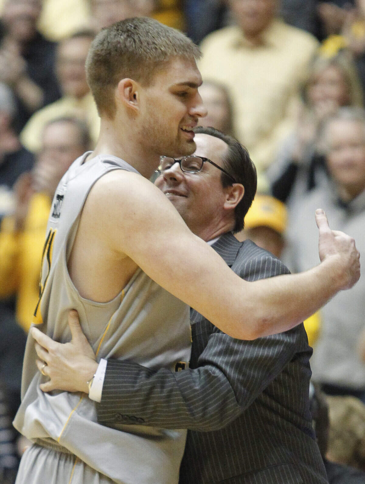 Coach Gregg Marshall hugs Garrett Stutz after he checks out of the game on Saturday afternoon at Charles Koch Arena. (Feb. 25, 2012)