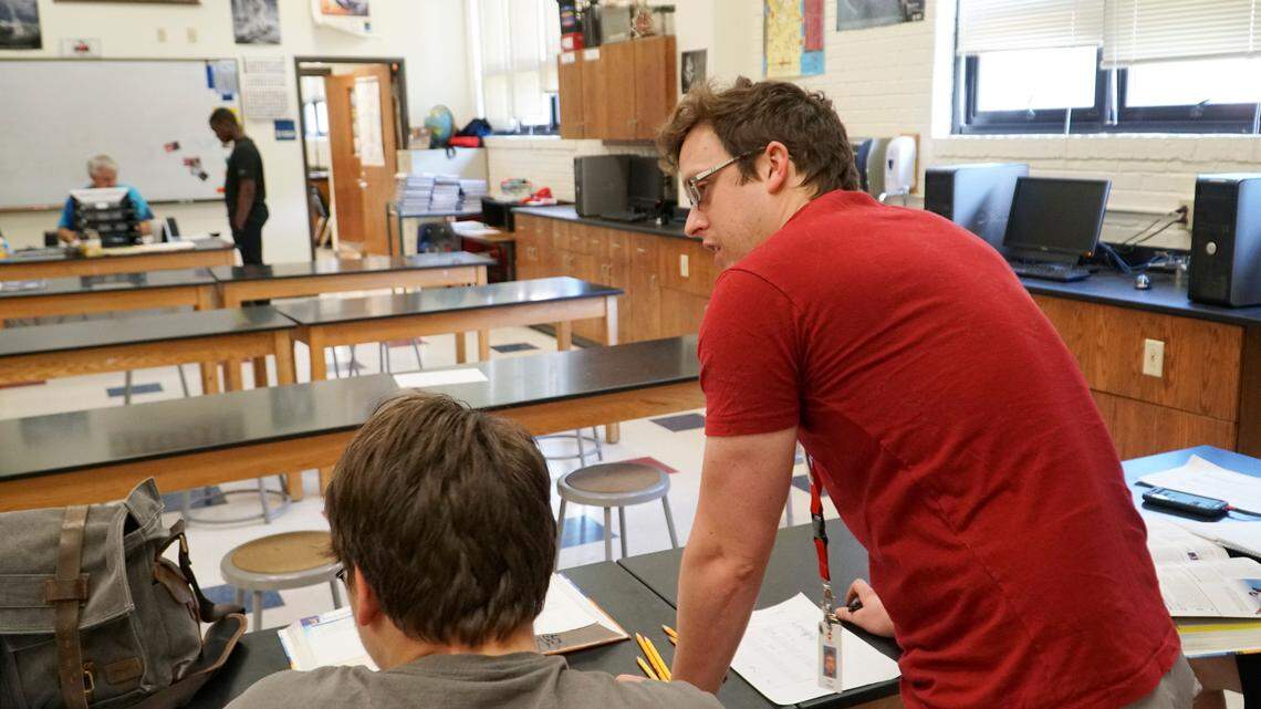 East High teacher Ryan Williams works on biology with a student in the extended school year program. (June 11, 2018)
