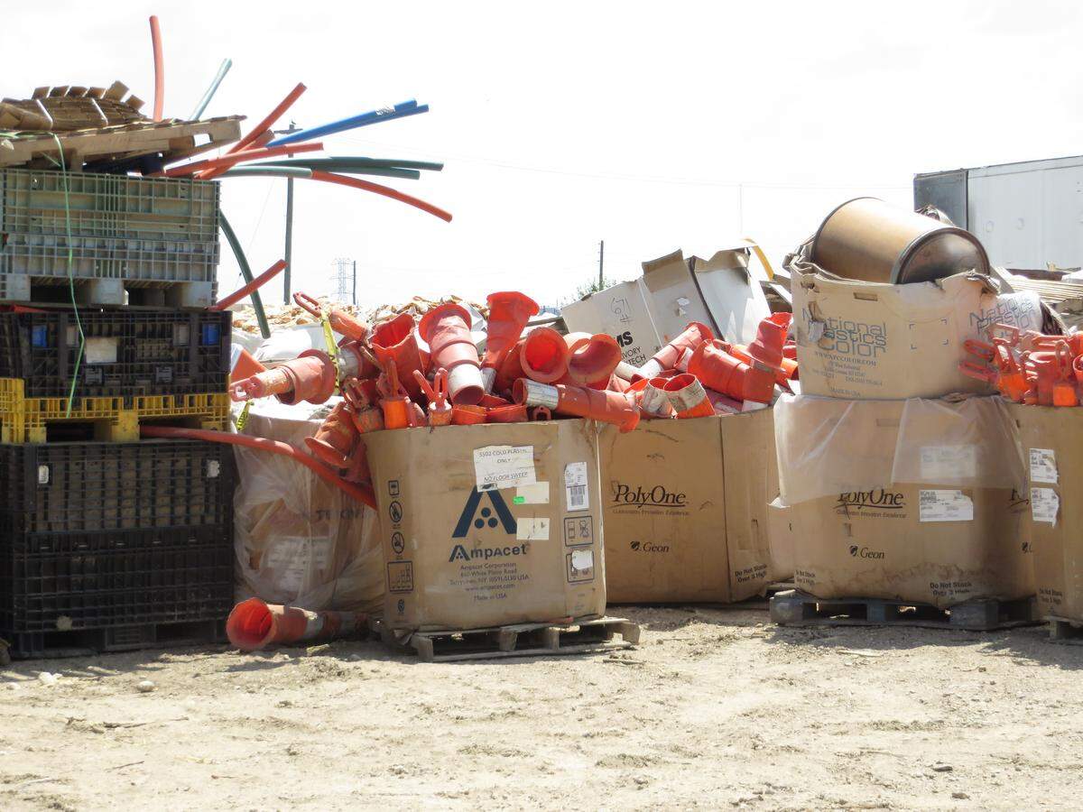 Worn-out traffic cones are among the tons of junk covering the IPS site just west of El Dorado.