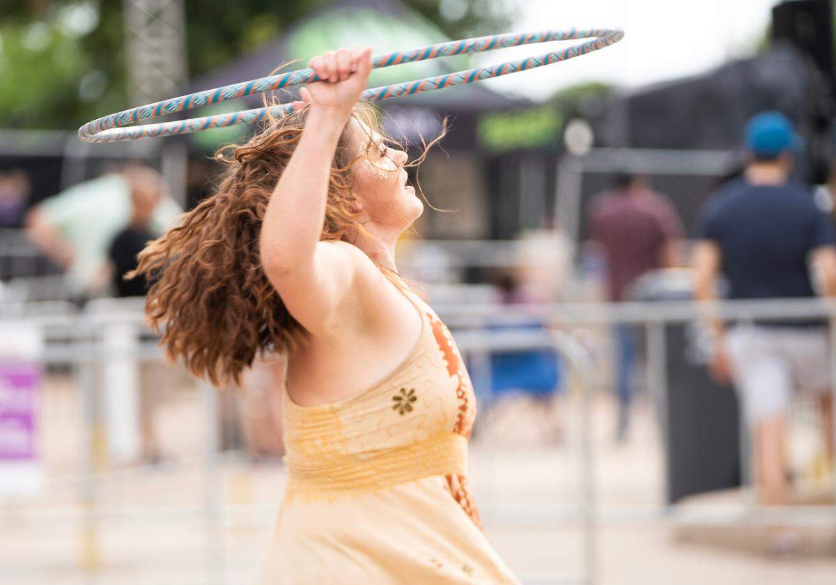 A hoop dancer performs at the Wichita Riverfest.