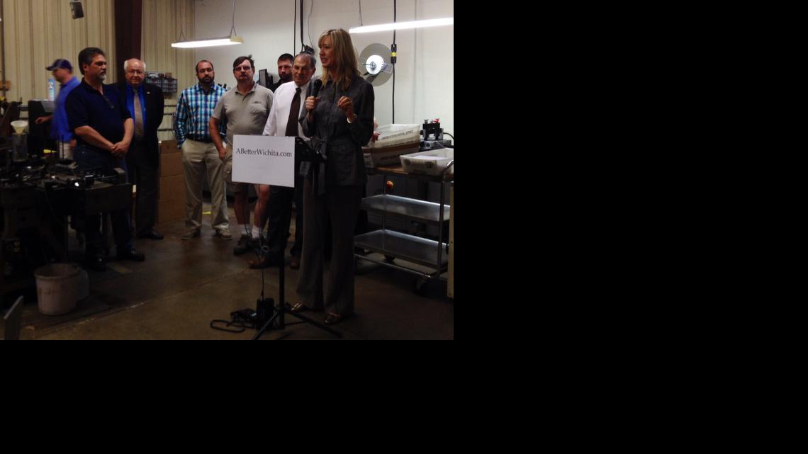 Jennifer Baysinger, a local business owner, speaks to a group of supporters for the newly formed Coalition for a Better Wichita on Wednesday at Handy Mailing, 3839 W. Dora. 

