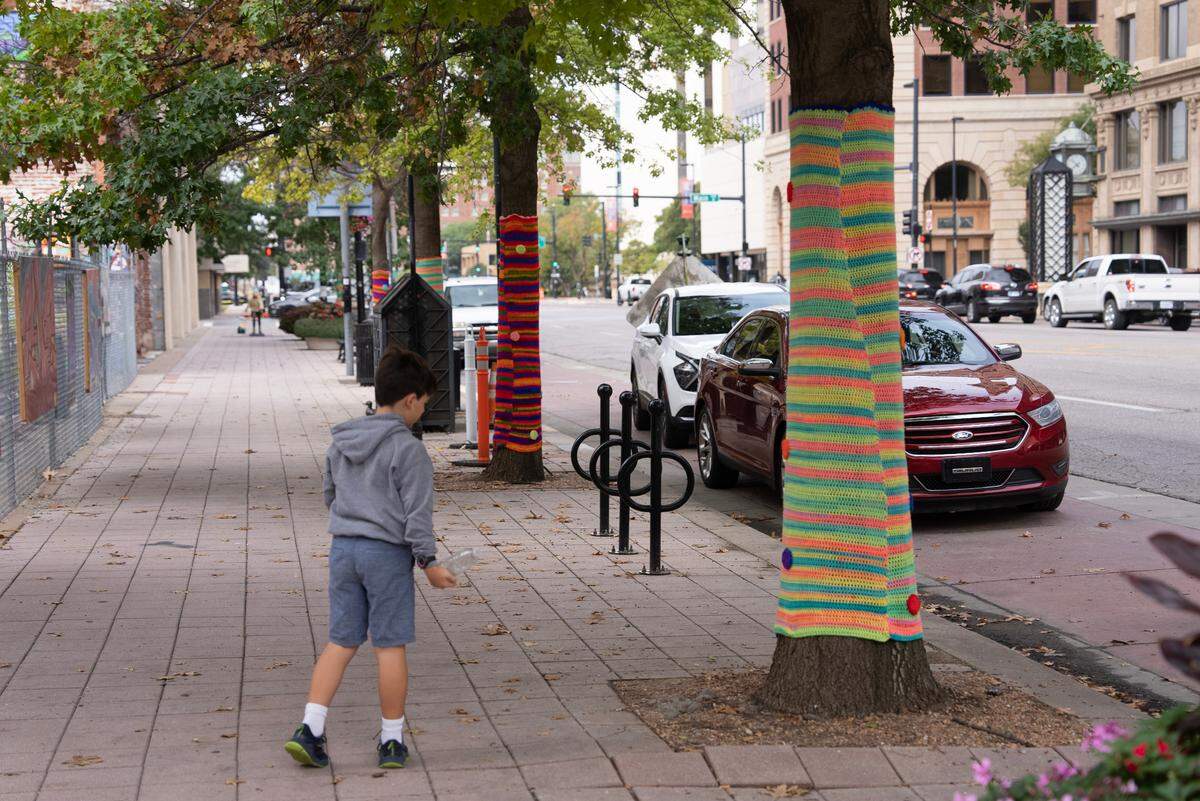 Crochet artist Tamara Gonzales used more than 20,000 yards of yarn and spent countless hours crocheting clothing for the statues along Douglas Ave. in downtown Wichita. She also wrapped a few trees in crocheted blankets.