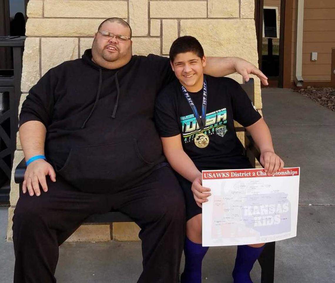 Willy Jon Morales with his father, Gabe, when he was wrestling for Augusta Wrestling Club.