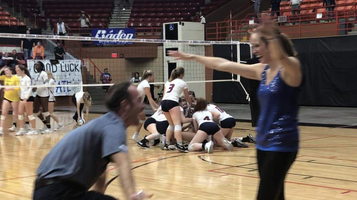 St. James Academy celebrates its second straight Kansas Class 5A state volleyball championship as coach Nancy Dorsey and her husband and assistant Bryan Dorsey embrace. (Oct. 27, 2018)