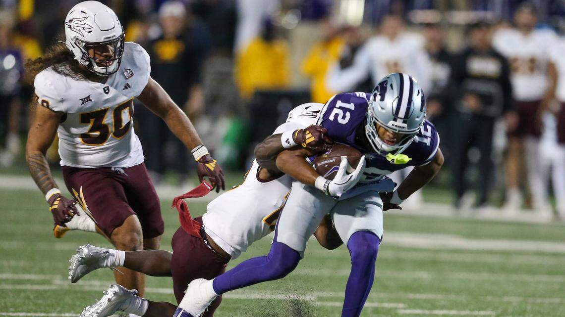 Kansas State Wildcats wide receiver Tre Spivey (12) is tackled by Arizona State Sun Devils defensive back Javan Robinson (12) during the fourth quarter at Bill Snyder Family Football Stadium.