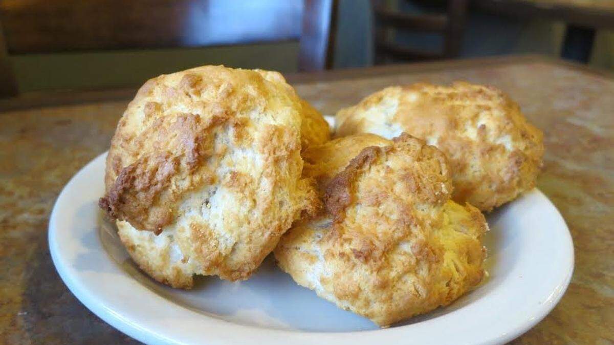 Le Monde Cafe at 602 N. West St. has long been known for its crumbly biscuits, above, its fattouch salad and its gyro.