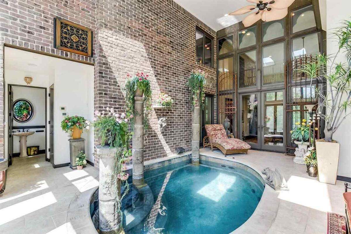 This indoor pool area at 1805 N Red Brush opens up into the backyard. The home is on sale for $1.25 million.