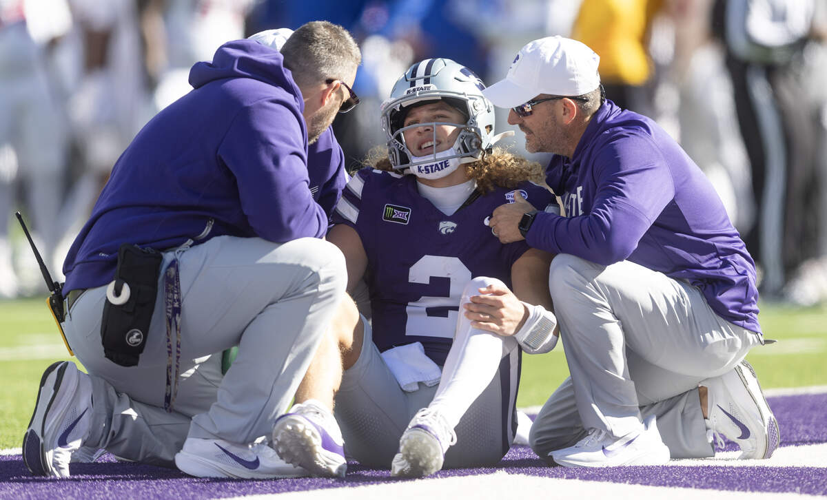 Kansas State quarterback Avery Johnson was shaken up after a long run during the first half of their game against Kansas in Manhattan on Saturday.