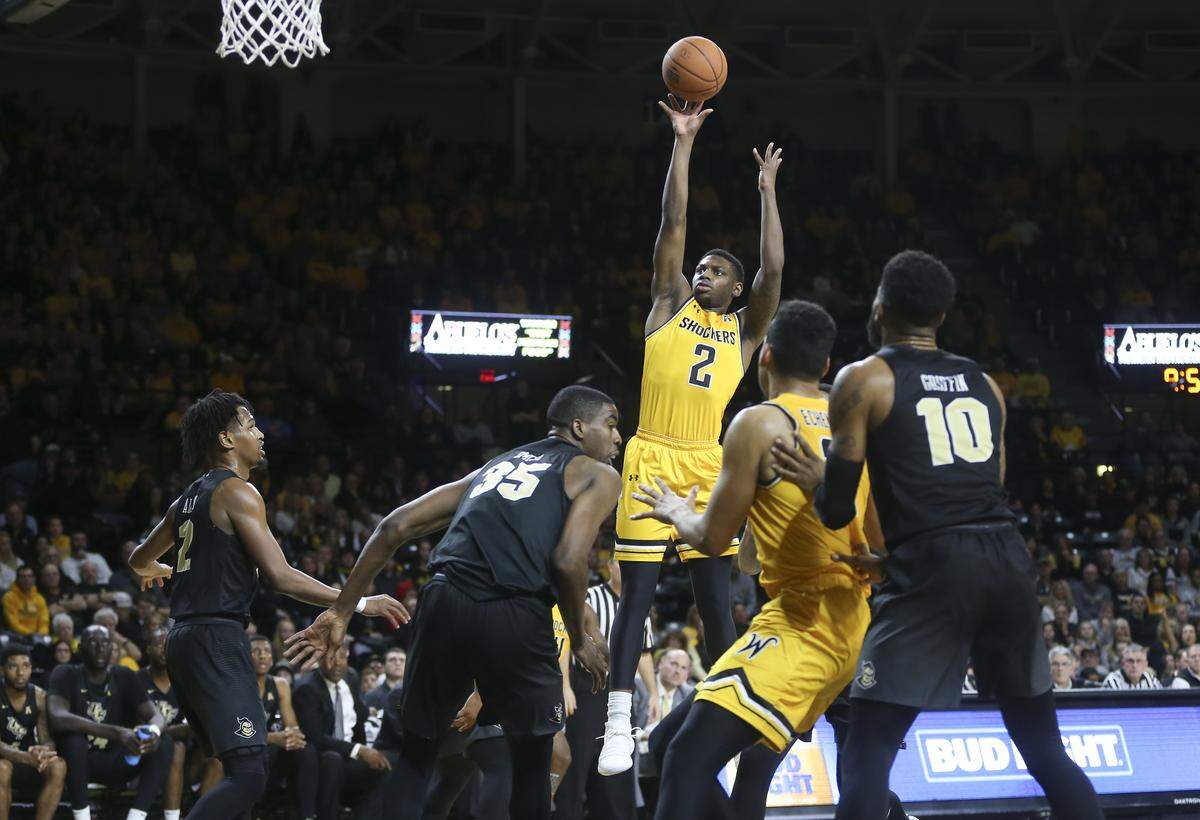 Wichita State guard Jamarius Burton takes a shot against UCF during the first half of their game at Koch Arena on Wednesday.