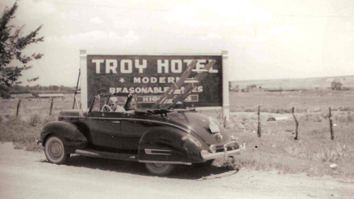 The late George Lay of George Lays Signs back in the days when he’d load his ladder in his convertible to go paint signs. His company is now selling to Wichita’s Miracle Signs.