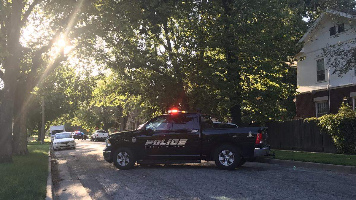 Wichita police block off roads in the area of the 1100 block of North Amidon as a SWAT team is engaged in a standoff Wednesday evening.