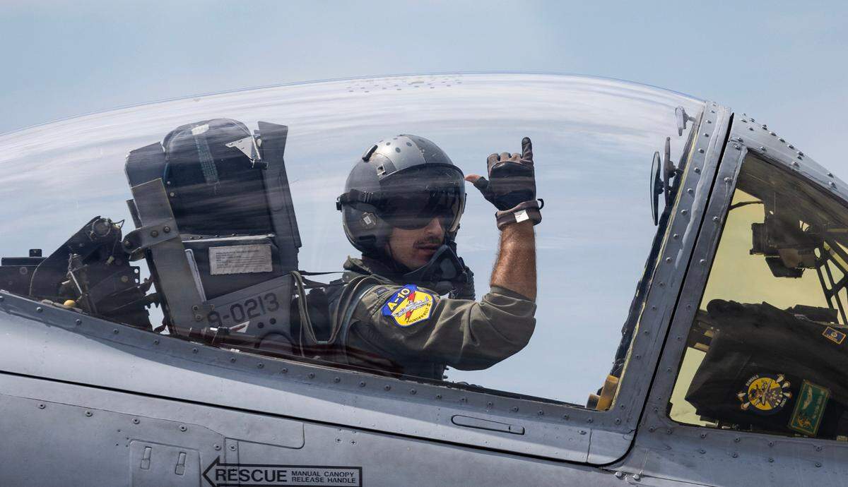 A pilot from the A-10 demonstration team acknowledges the crowd on Saturday during the Frontiers in Flight airshow at McConnell Air Force Base.