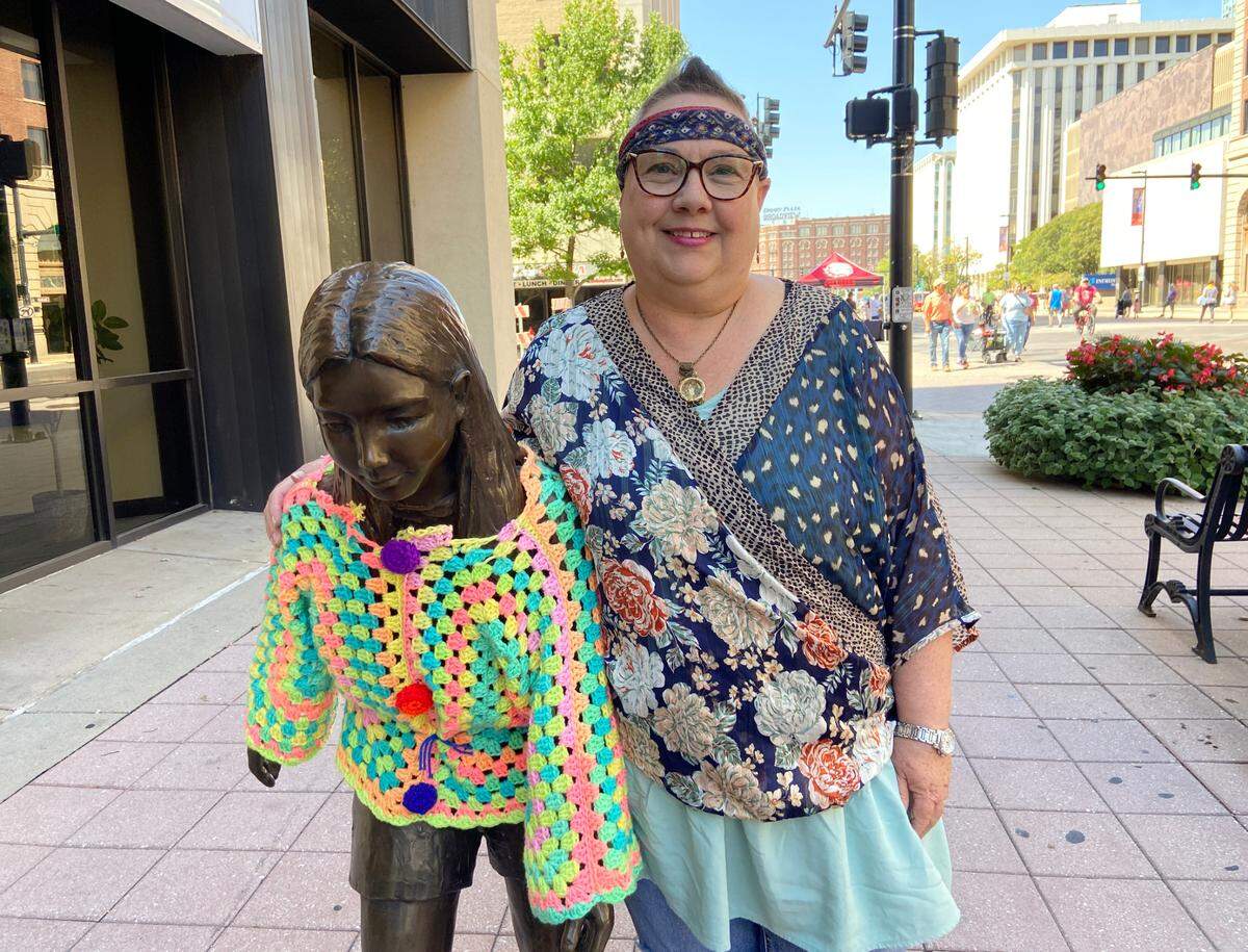Crochet artist Tamara Gonzales used more than 20,000 yards of yarn and spent countless hours crocheting clothing for the statues along Douglas Ave. in downtown Wichita. She also wrapped a few trees in crocheted blankets.