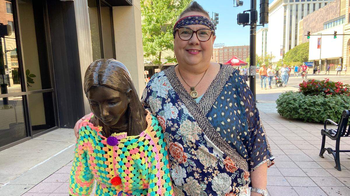 Crochet artist Tamara Gonzales used more than 20,000 yards of yarn and spent countless hours crocheting clothing for the statues along Douglas in downtown Wichita. She also wrapped a few trees in crocheted blankets.