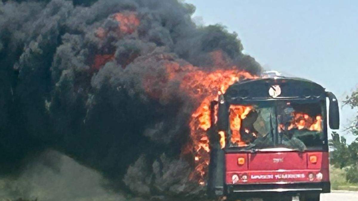 A USD 408 bus was destroyed in a fire Friday on I-135. The bus was bringing back the high school football team and coaches from football camp. Everyone escaped unharmed.