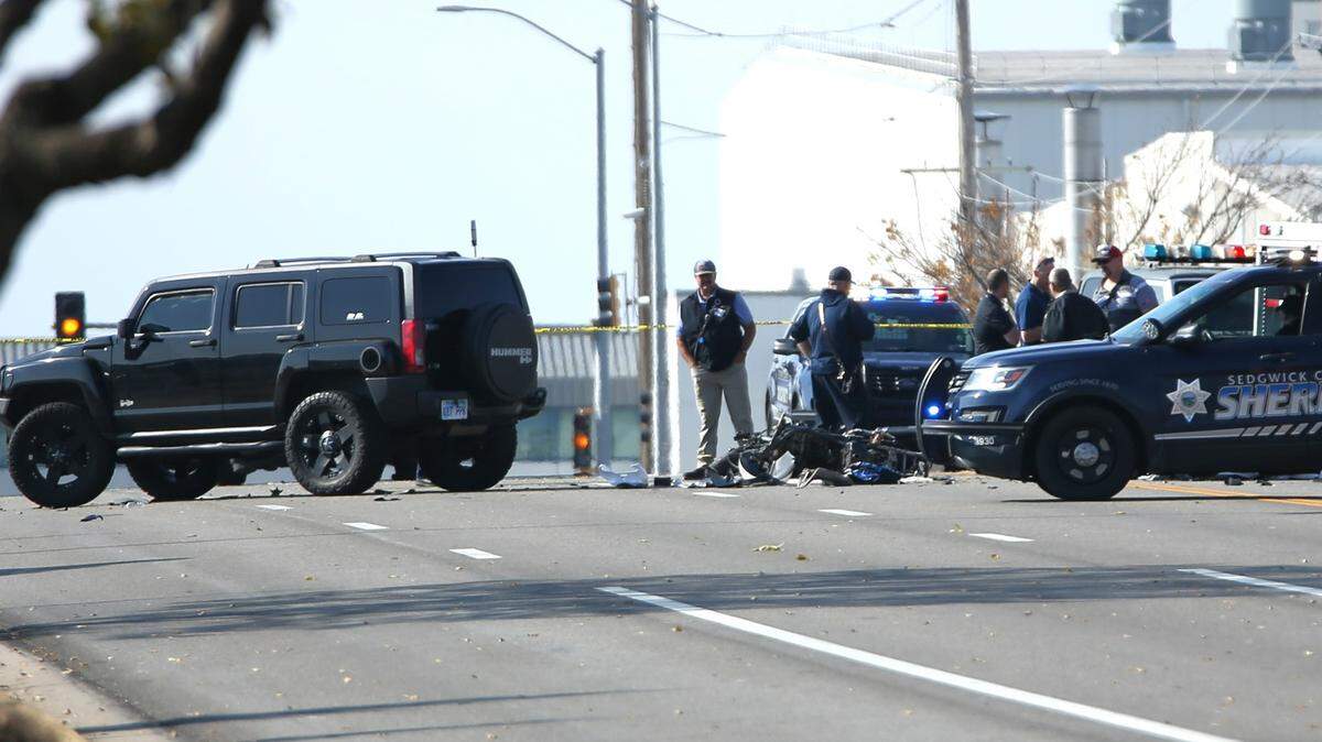 Authorities work the scene of a deadly accident near Oliver and MacArthur on Wednesday.