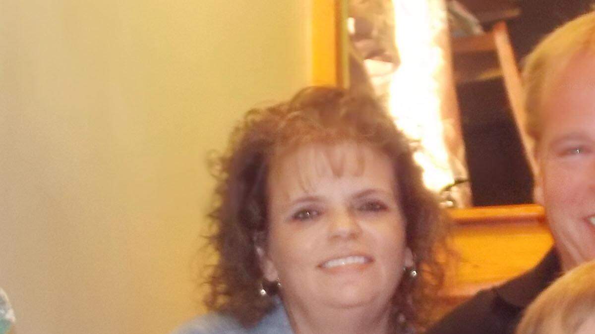 Danielle Zimmerman, upper left, died after having a medical problem while in a Taco Bell drive-through. While she was unconscious, someone stole her belongings, including her wedding ring. She's seen with her husband, Kris, and her two sons, Noah, 13, and Alex, 18. 