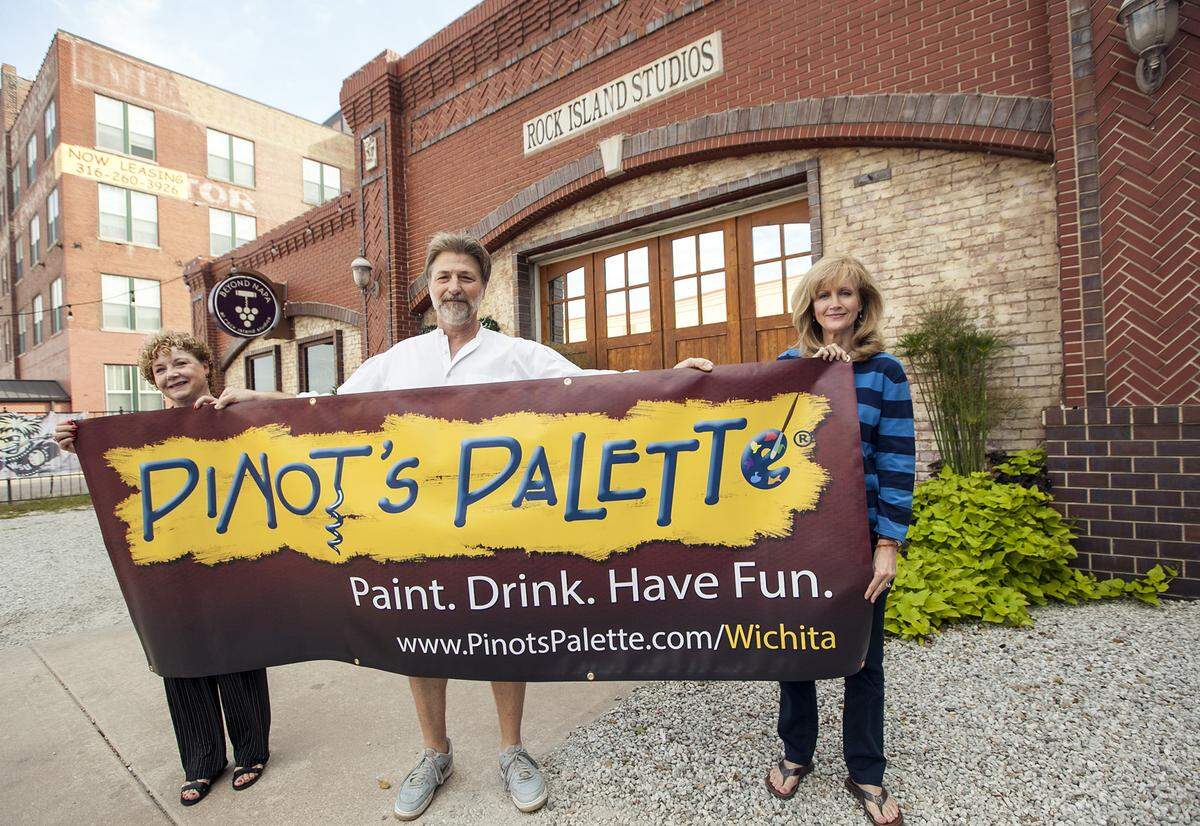 Ruthanne Timm-Siedhoff, left, Don Siedhoff, center, opened Pinot’s Palette in Old Town Square in 2015.