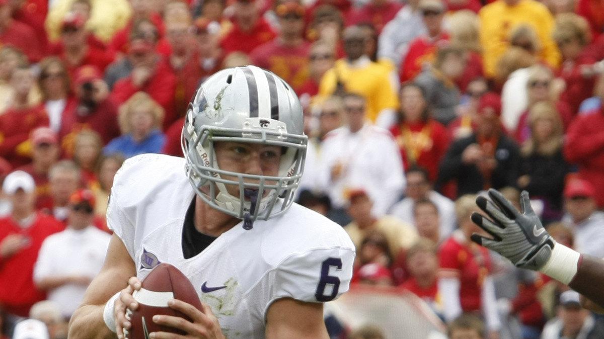 Kansas State quarterback Grant Gregory looks for a hole as he scrabbles close to the goal line Saturday in Kansas City. Gregory made his first start a quarterback leading the Wildcats over Iowa State 24-23.