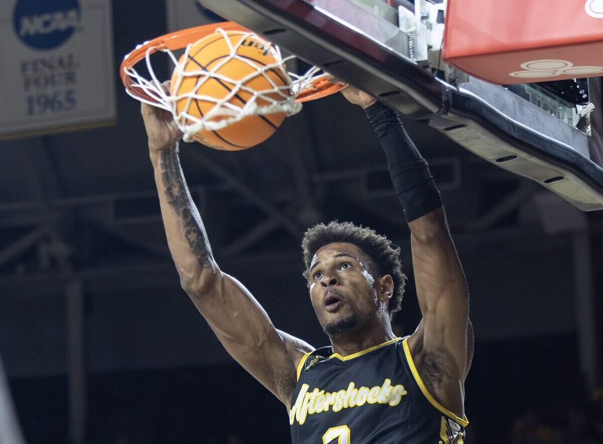 Corey Washington dunks the ball during the first half of their opening game of the TBT tournament against The Enchantment at Koch Arena on Monday night.