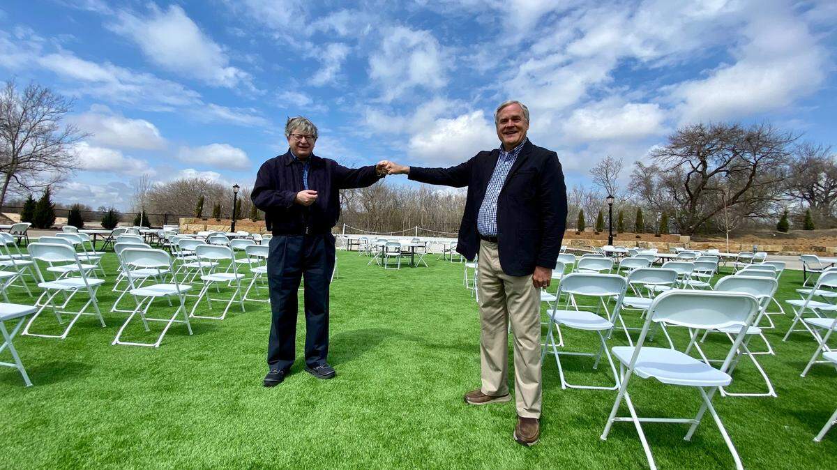 Wichita Symphony Orchestra Director Don Reinhold, left, and Botanica Director Marty Miller, right, are partnering for a May concert experience at Botanica, an event they hope will launch an ongoing partnership.