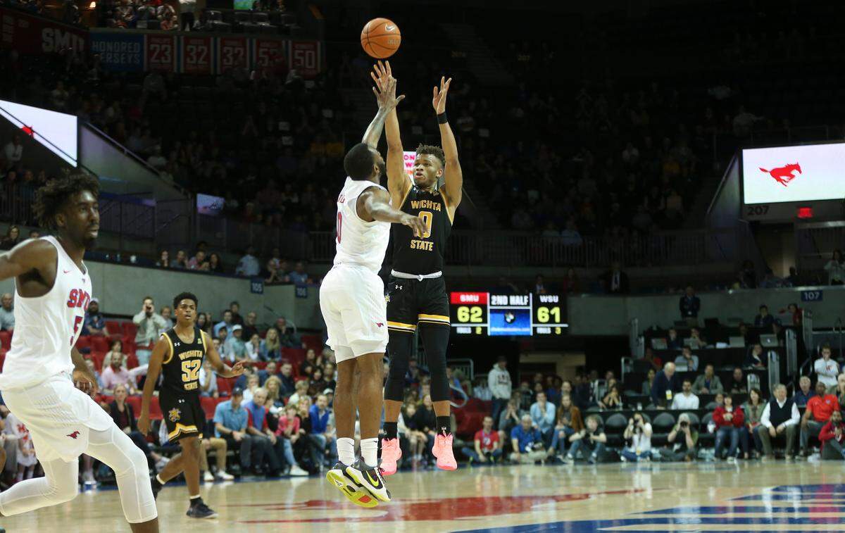 Dexter Dennis hits a three-pointer to complete a dramatic comeback after being down 24 to SMU in the second half. Wichita State went on to win 66-62.