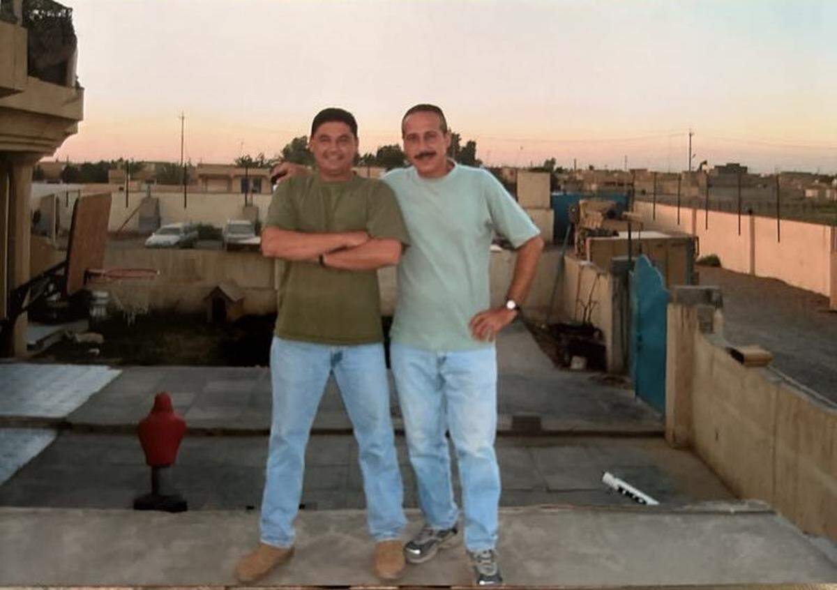 Farris Toma (right) went to visit his cousin, Hani Sami Stefan (left), while the two were serving as interpreters for U.S. soldiers during the Iraq War.