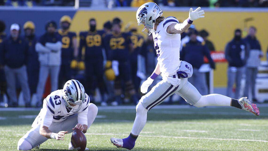 Kansas State punter Ty Zentner (8) kicks a field goal during the first half of an NCAA college football game against West Virginia in Morgantown, W.Va., Saturday, Nov. 19, 2022. (AP Photo/Kathleen Batten)