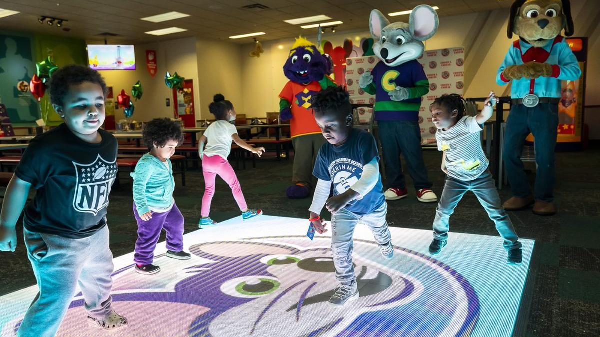 The remodeled Chuck E. Cheese in Wichita has an interactive dance floor that lights up as children move on it.